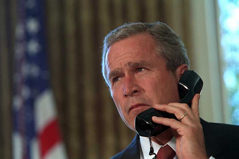 George W. Bush makes a call. Did the call have profanity? Source: Public Domain.