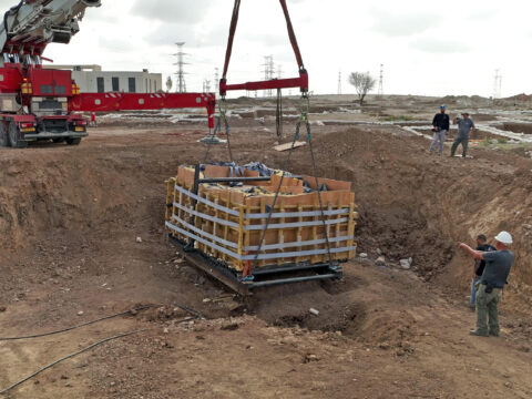Intact Second Temple mikveh being lifted from the Carmei Gat excavation, Kiryat Gat.