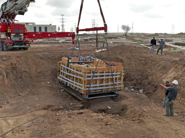 Intact Second Temple mikveh being lifted from the Carmei Gat excavation, Kiryat Gat.