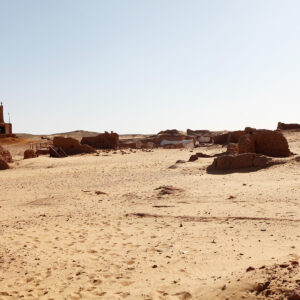 Eroded mud-brick tomb ruins in the sand at the Bir el-Shaghala necropolis near Mut in Egypt's Dakhla Oasis