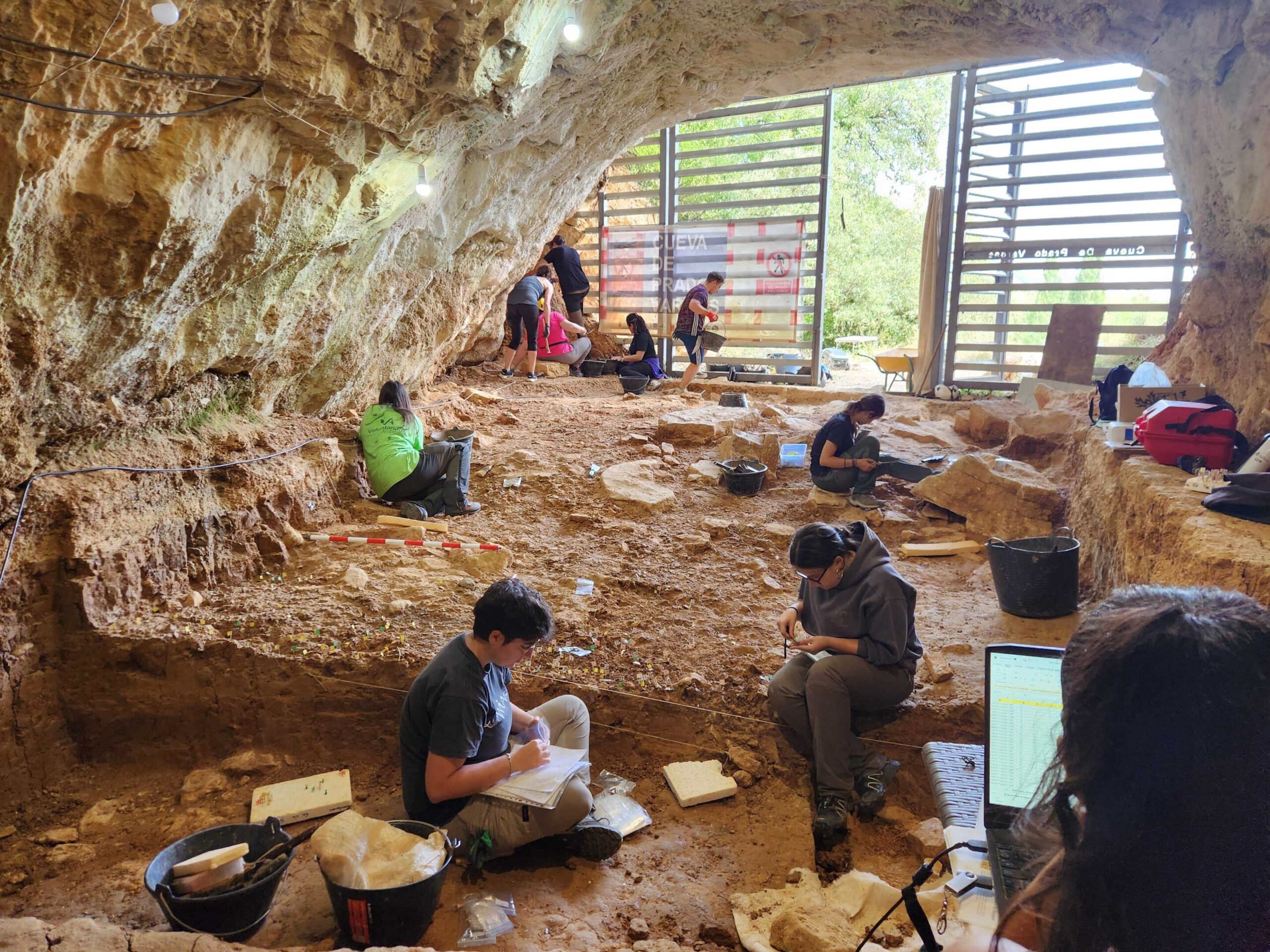 Archaeologists excavating Neanderthal sublevel 4D at Prado Vargas Cave, Ojo Guareña, Burgos